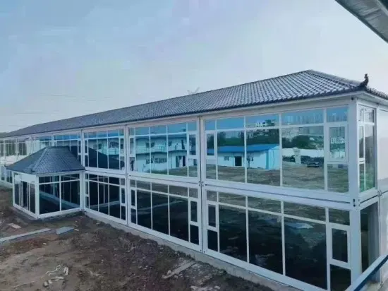 Two-storey modular building with full-height glazing and a pitched roof