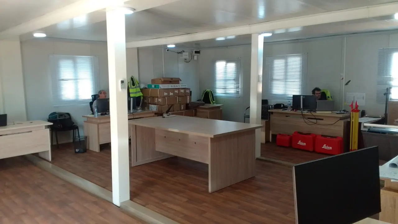 Fitted-out modular office interior with desks, chairs and storage